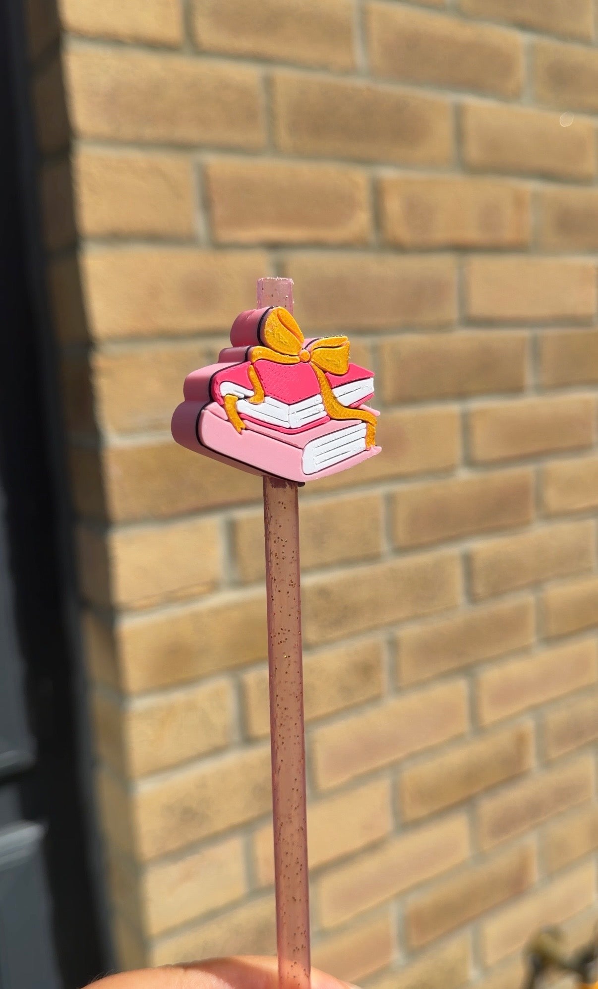 Books and bow straw topper