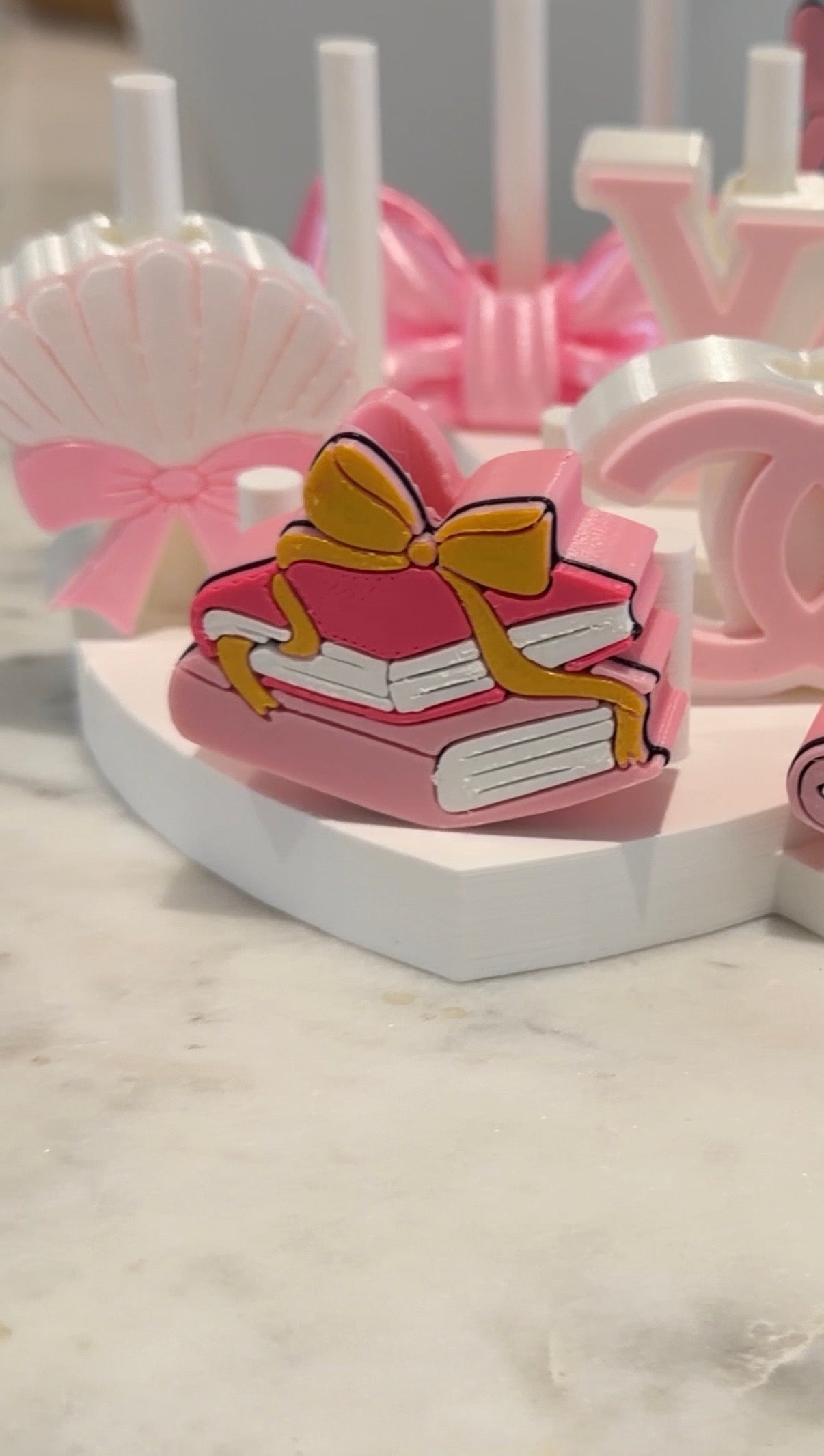 Books and bow straw topper