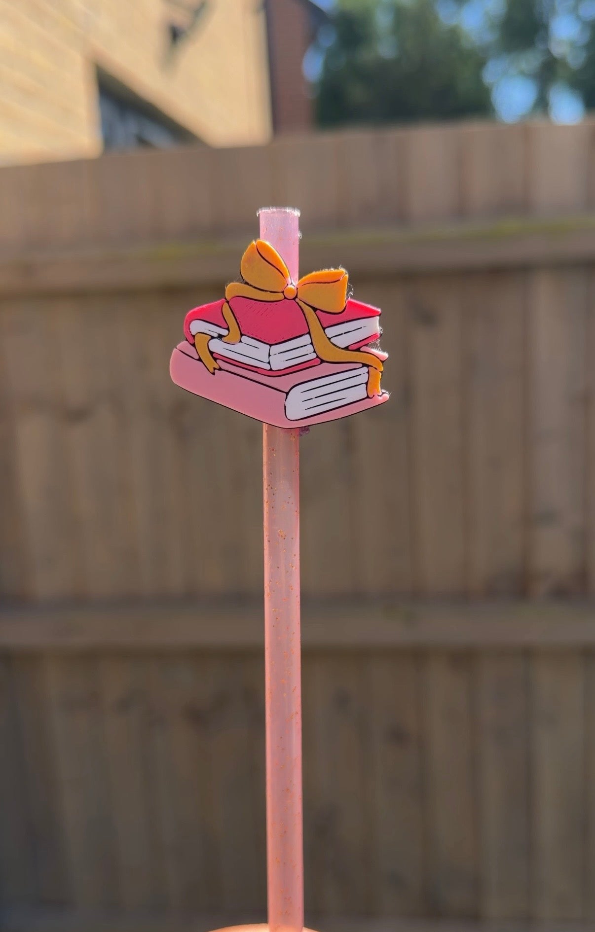 Books and bow straw topper